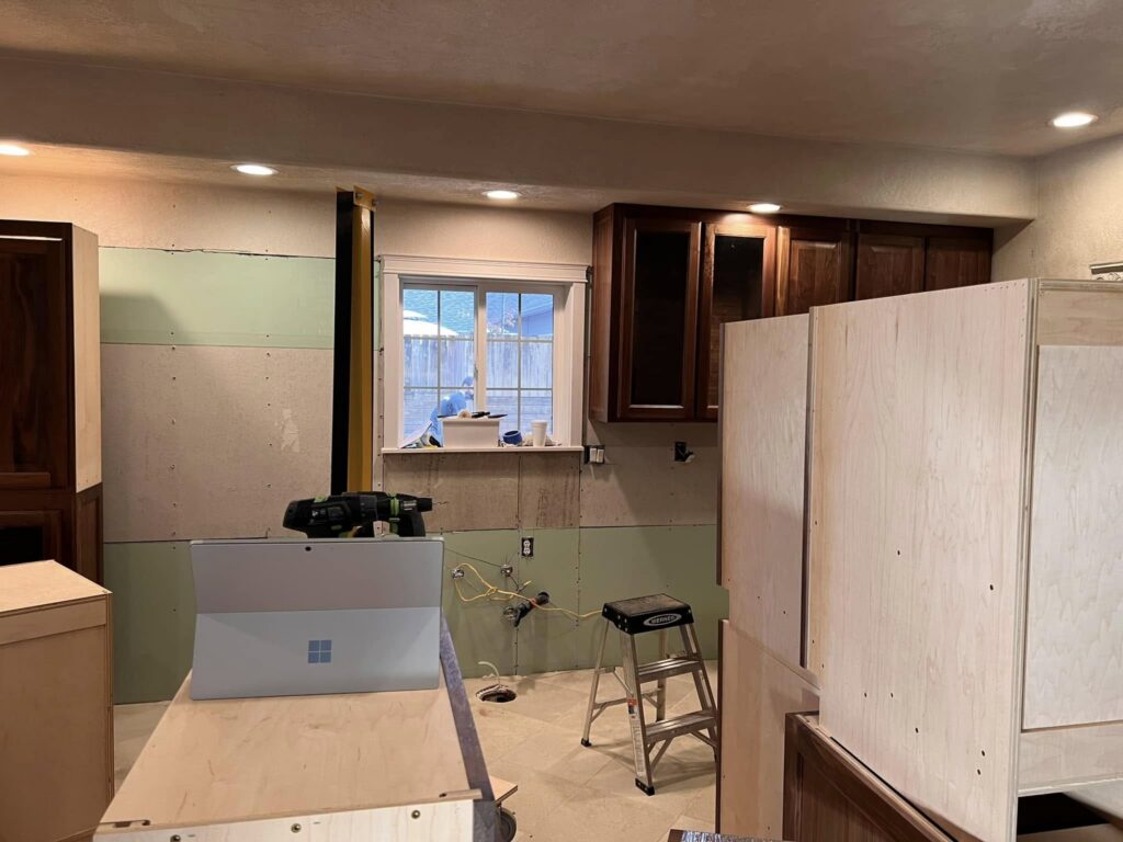Walnut kitchen cabinets and island boxes during installation