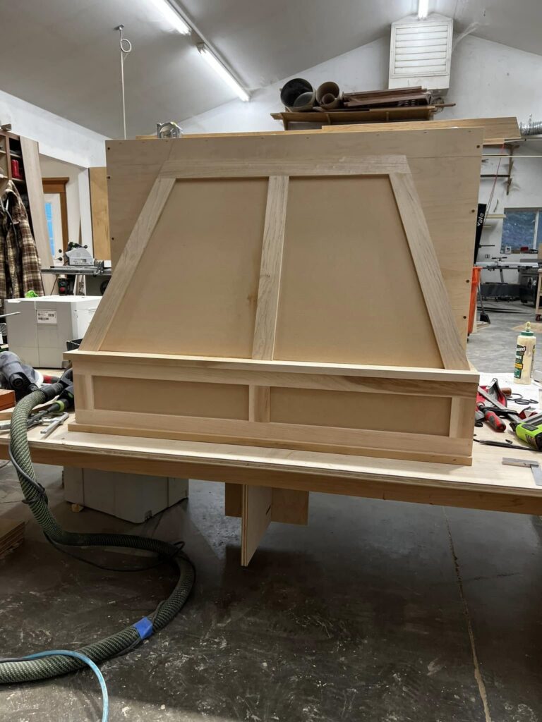 Unfinished custom range hood enclosure in the workshop