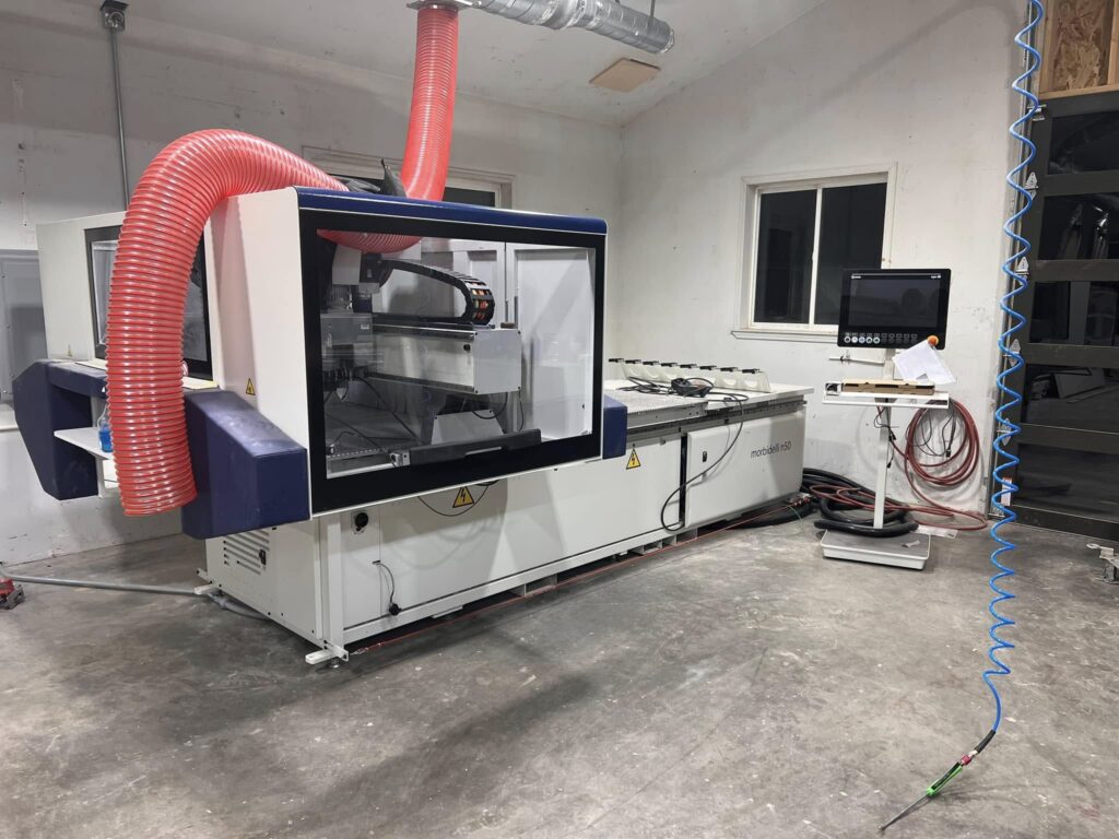 CNC woodworking machine in JBL Fine Finish's workshop