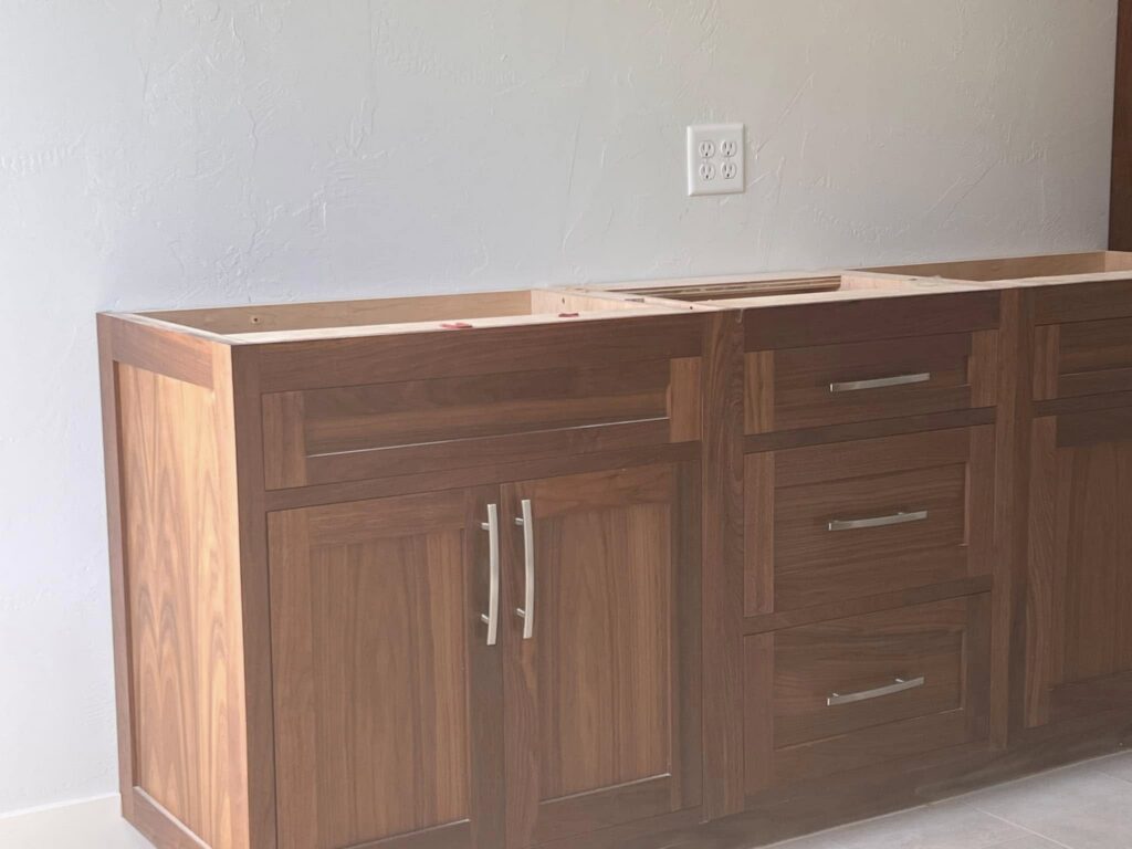 Walnut sideboard-style cabinetry installed against a wall