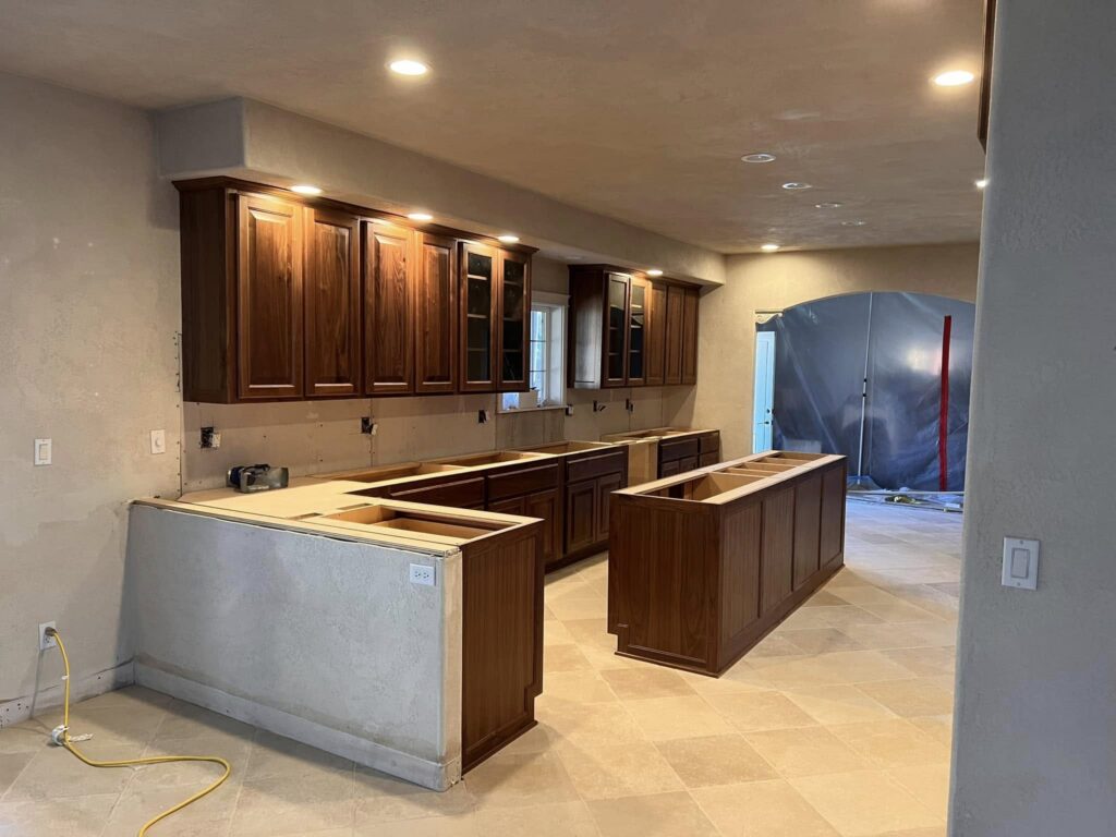 Walnut kitchen cabinets and island during installation