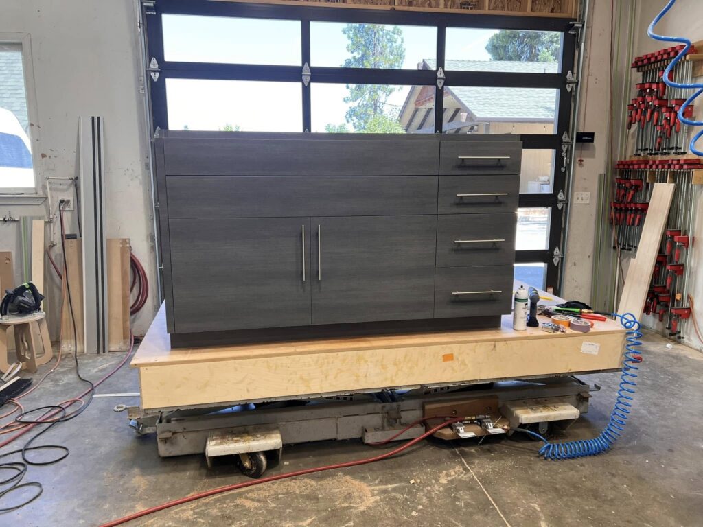 Gray sideboard cabinetry on a rolling shop platform