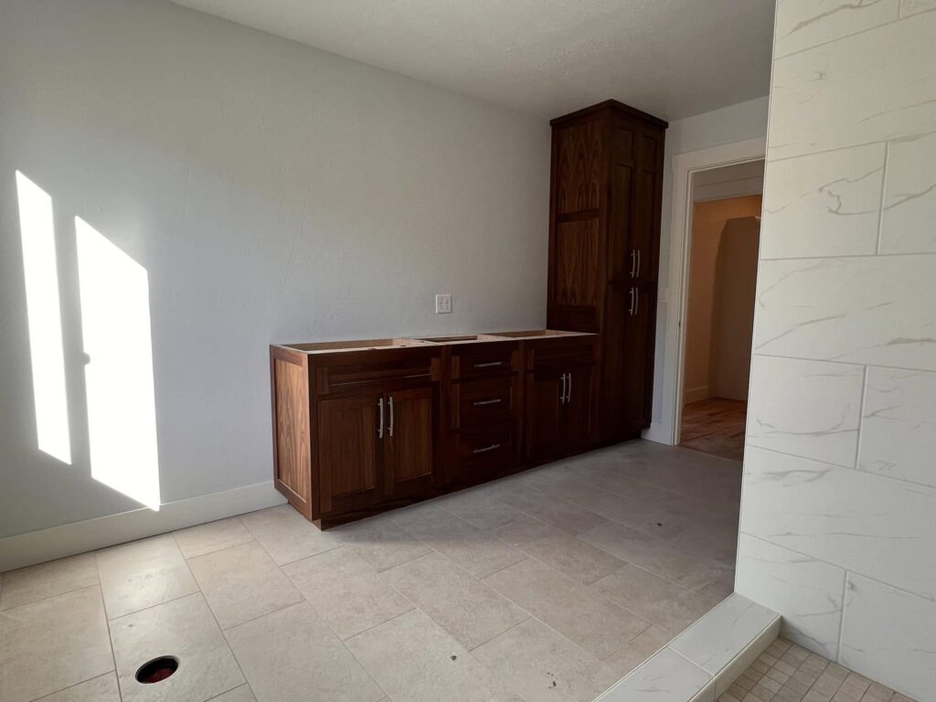 Walnut sideboard cabinetry installed in a bright room