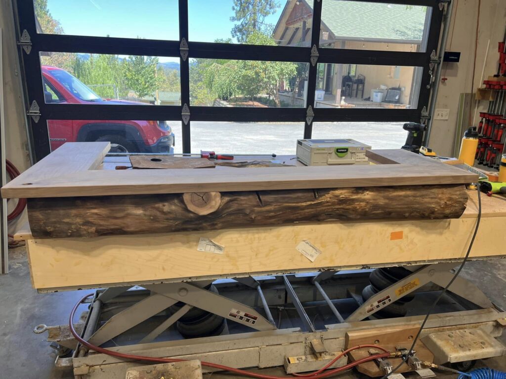 Live-edge counter being fitted and measured in the workshop